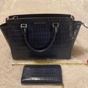 Authentic Michael Kors Alligator embossed handbag in navy blue.